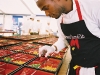 A sous-chef prepares an elaborate meal in Anton Mosimann’s kitchen