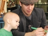 Hayden Christensen with a child from SickKids. 
