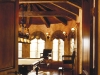An ornate hobby room boasting luxurious woodwork and grand windows is the ideal place to relax. 