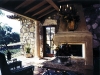 Relax by the fireplace – outside. There’s nothing like an evening of camping at home with a glass of wine.