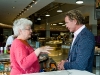 McEwan casually chatting with a customer.