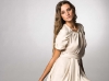 Slip into crisp, clean elegance with this cream-coloured dress cinched at the waist.