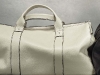 Perfect for the high-flying man, this cylindrical, beige leather travel holdall from Zegna is a summer staple for entrepreneurs with edge.