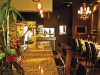The classy, vibrant interior leaves me inebriated with wonder. Fine granites, leathers, and woodworks glisten in the candlelight, while an elaborate stretched bar displays a collection of the finest Old World Italian wines, cognacs, grappa, and amaro. 