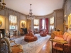 A delicate crystal chandelier complements this space’s sovereign décor. Photo courtesy of Burger Sotheby's International Realty   