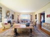 Light fills this inviting living room, which seamlessly transitions to the sea. Photo courtesy of Burger Sotheby's International Realty  