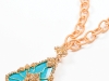 The pinnacle of Italian jewelry, this gold Rina Limor necklace embraces a bold turquoise stone and glitters with a collection of diamonds. 