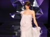 With layers of flowing fabric, this soft pink gown is fit for a Grecian goddess. The dress features a hint of beading along its length, hidden beneath a  sheer overlay.  www.abedmahfouz.com