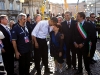 President Barack Obama greets bystanders, as he tours earthquake damage in L'Aquila with Prime Minister Silvio Berlusconi while attending the G-8 summit in L'Aquila, Italy, July 8, 2009.