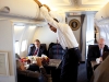 President Barack Obama talks with White House Chief of Staff Rahm Emanuel and Senior Advisor David Axelrod, Senior Advisor during the flight to Caen, France June 6, 2009. 