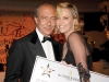 Actress Charlize Theron lends a helping hand at the de Grisogono-sponsored Hollywood Domino Tournament, which aimed to raise money for the Art of Elysium. 