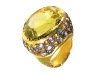 With a glittering yellow quartz atop orange, white and pink sapphires, this lemon topaz ring by Sazingg demands attention. www.vivre.com