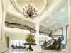 Saxony Manor regal foyer with 23-foot high, coffered ceilings and a celestial sea of LED lights that like stars, quietly complement a crystal and antique wrought-iron chandelier.
