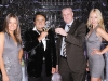 Russian Standard Vodka founder Roustam Tariko, left, raises his glass in the company of prominent guests. 