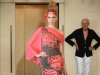 This Asian-inspired dress with exposed shoulder reveals Riva's love for clean lines.