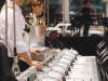 A skilled chef prepares for take-off, where he’ll serve a mouth-watering, three-course meal. 