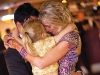 Rachel and Sonny express their love with daughter Rylee at their wedding ceremony.