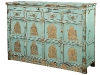 Tracy Porter's teal vintage chest, embellished with golden deities and Buddhas.